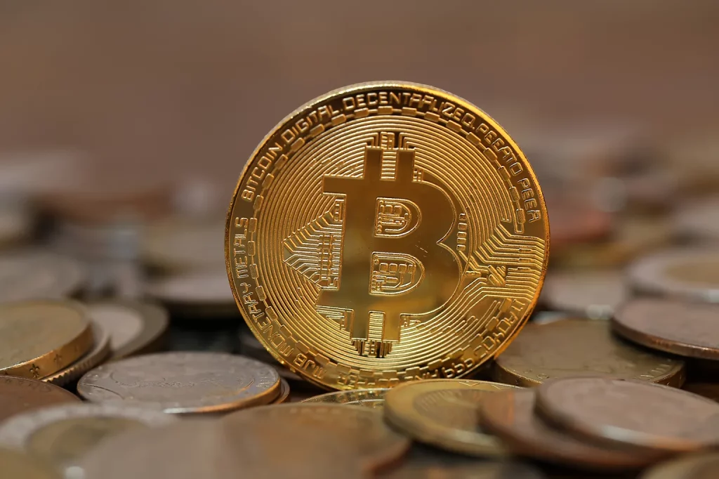 Is Bitcoin the Safe Haven of the Future selective-focus-shot-of-a-bitcoin-in-a-pile-of-coi-2025-02-09-01-06-12-utc.jpeg 1
